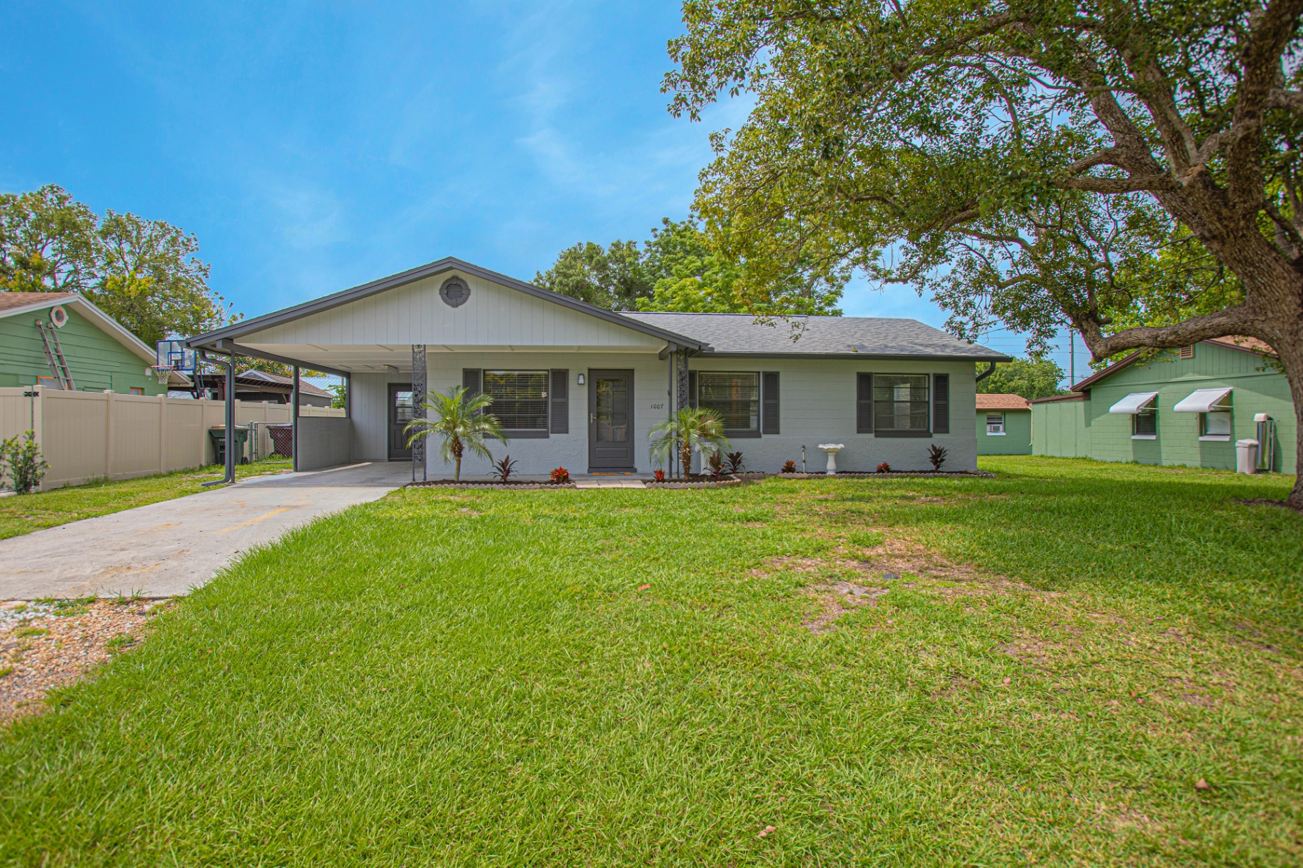Updated block home with carport and manicured lawn