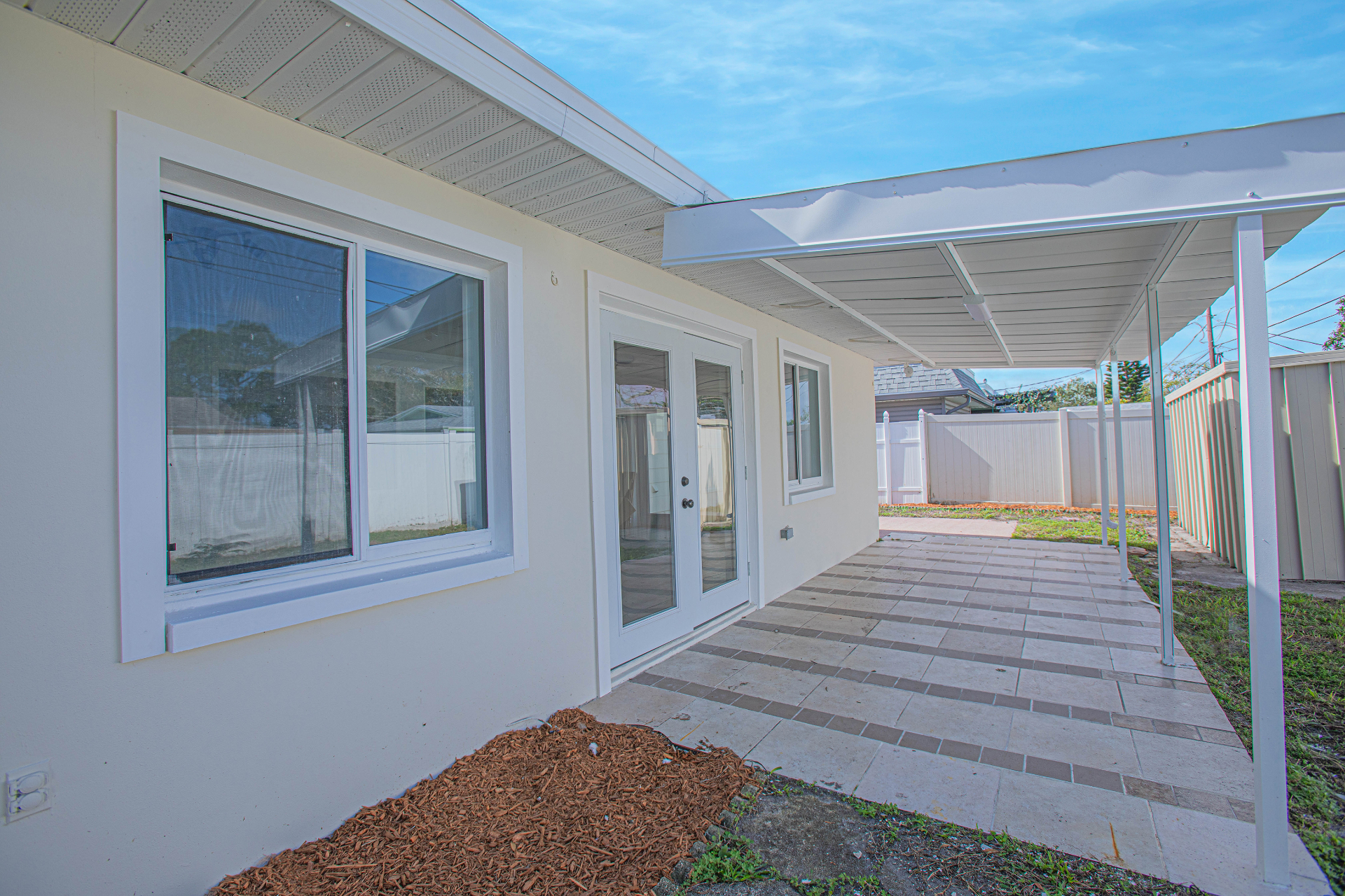 Covered rear patio of a renovated Florida home